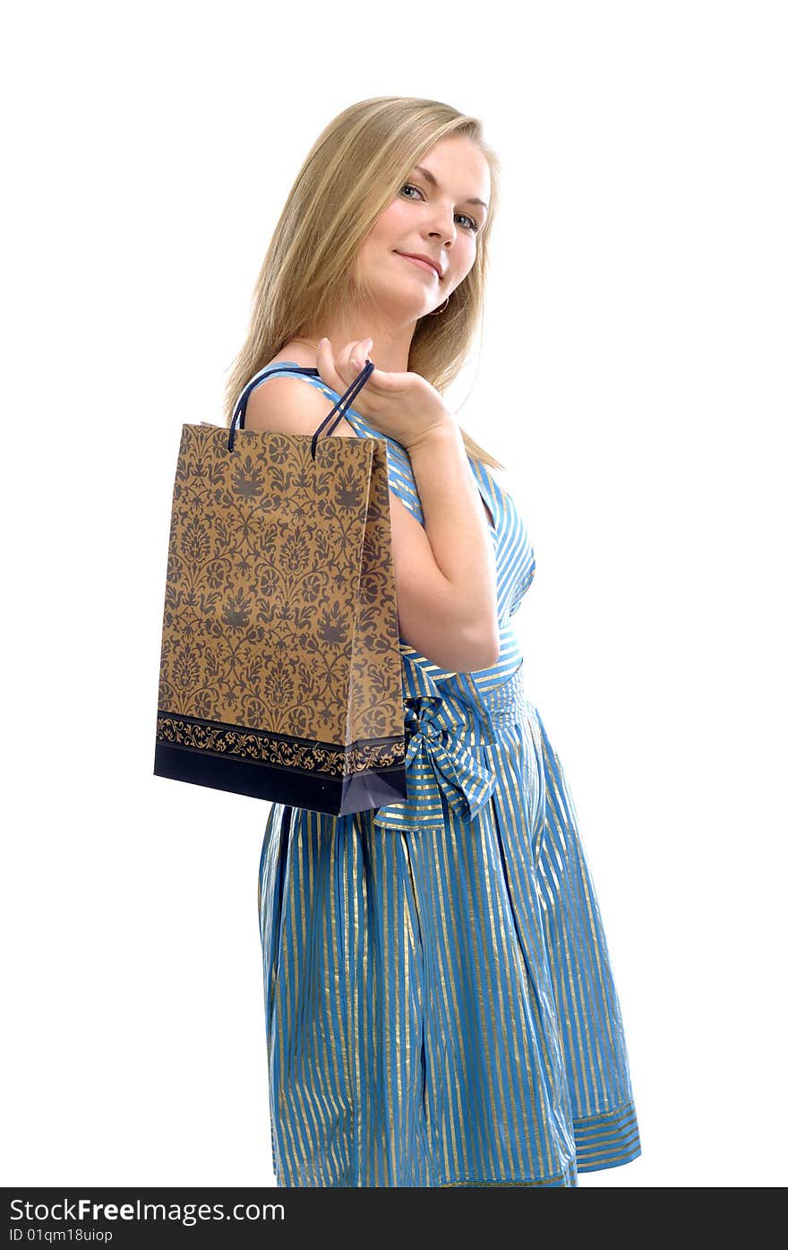 Young pretty girl with bag in blue dress isolated on white