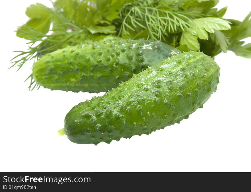 Green cucumber vegetable fruits with leafs isolated on white background