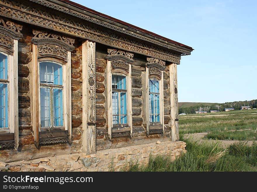 Part of russian izba with grass and sky. Part of russian izba with grass and sky