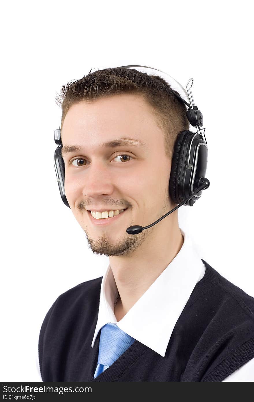 Portrait of a smiling young guy with headphones on his head, isolated over white background