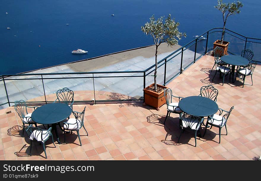 Cafe terrace in front of the sea.