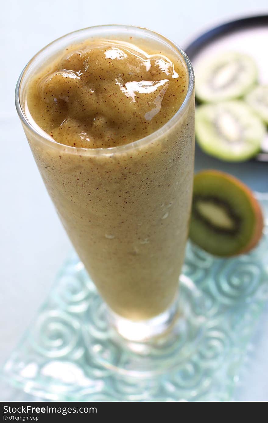Kiwi juice, focus on the top of the glass. see the texture of fruit juice, look delicious.