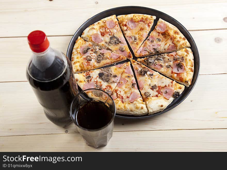 A couple of delicious pizzas, with raw tomatoes, green peppers and mushrooms. A couple of delicious pizzas, with raw tomatoes, green peppers and mushrooms