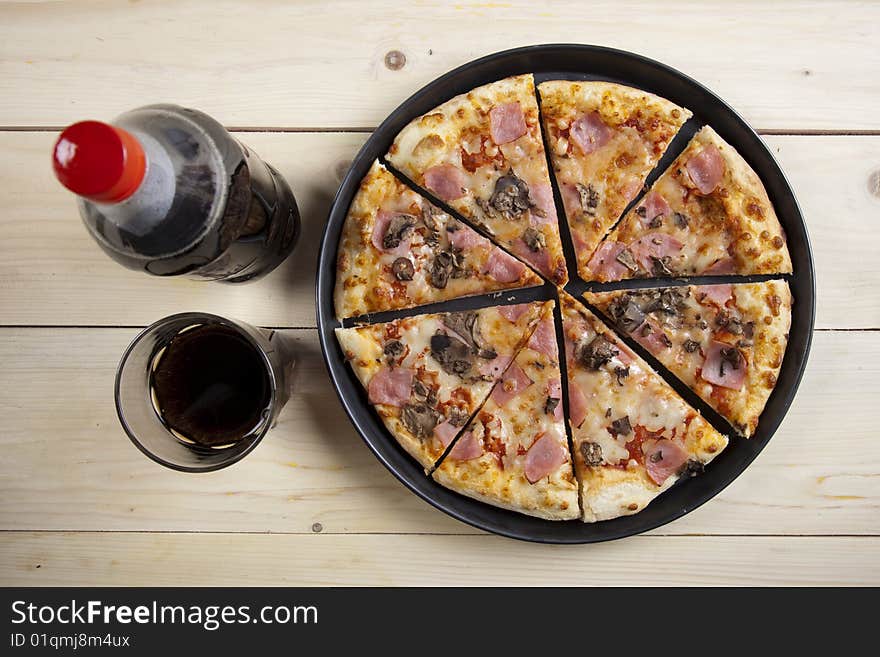 A couple of delicious pizzas, with raw tomatoes, green peppers and mushrooms. A couple of delicious pizzas, with raw tomatoes, green peppers and mushrooms