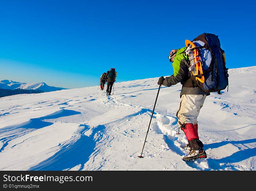 Hiker in high winter mountains