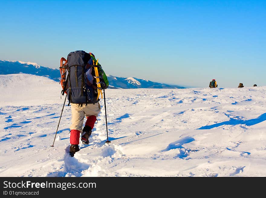 Hiker in high winter mountains