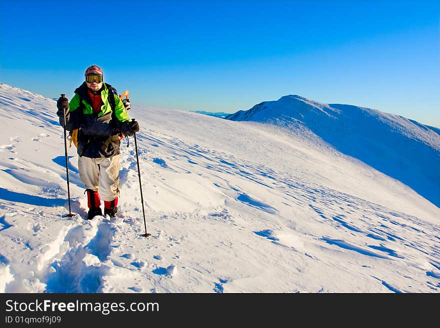 Hiker in high winter mountains