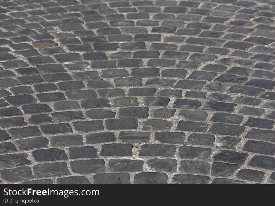 Old medieval granite cobble road