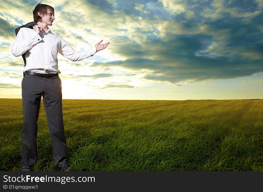 Young  business man show hand in field