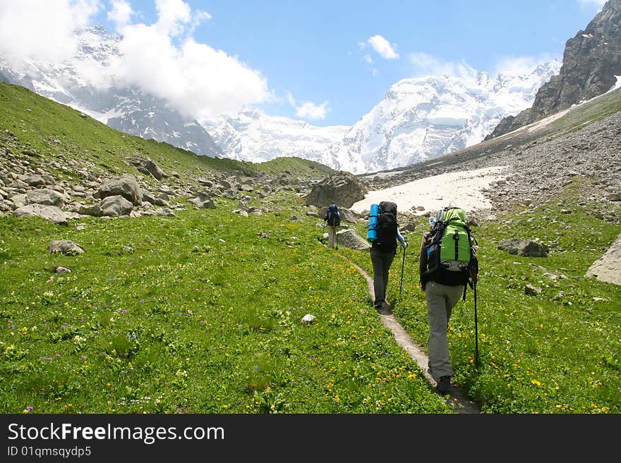 Hikers family  in Caucasus mountains