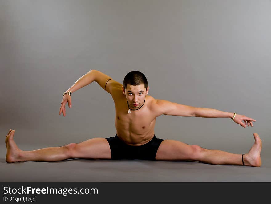 Young dancer over gray background