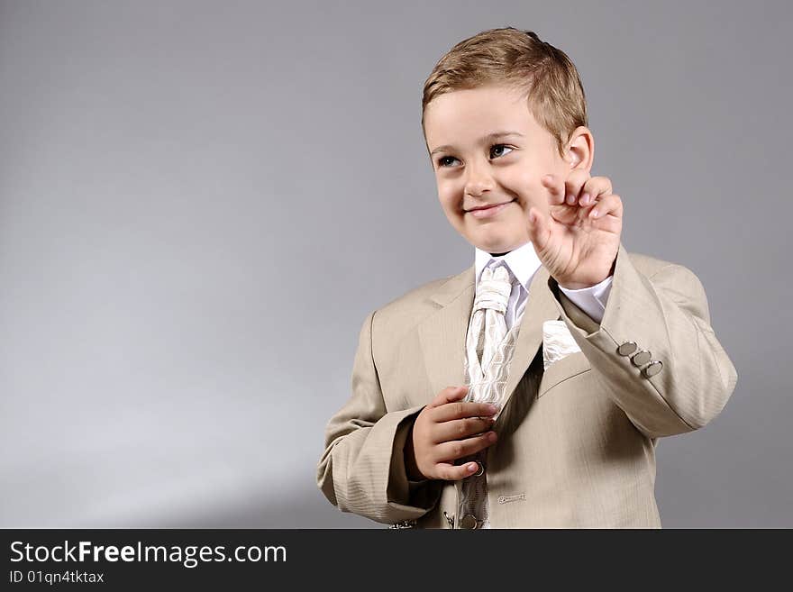 Portrait of a boy showing with his fingers. Portrait of a boy showing with his fingers