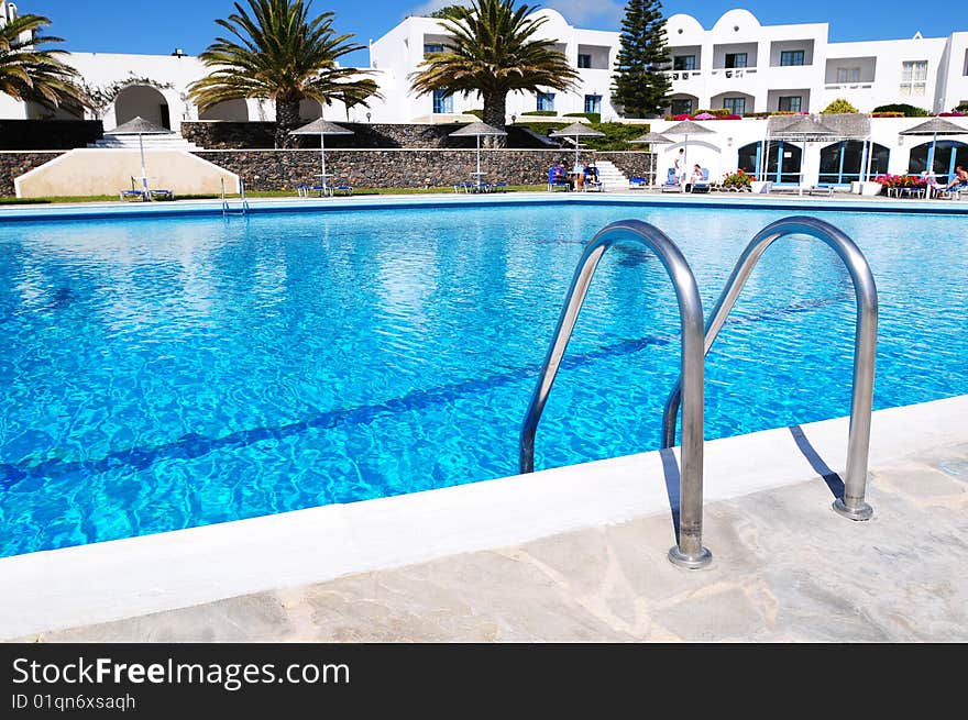 Beautiful blue swimming pool and handrails