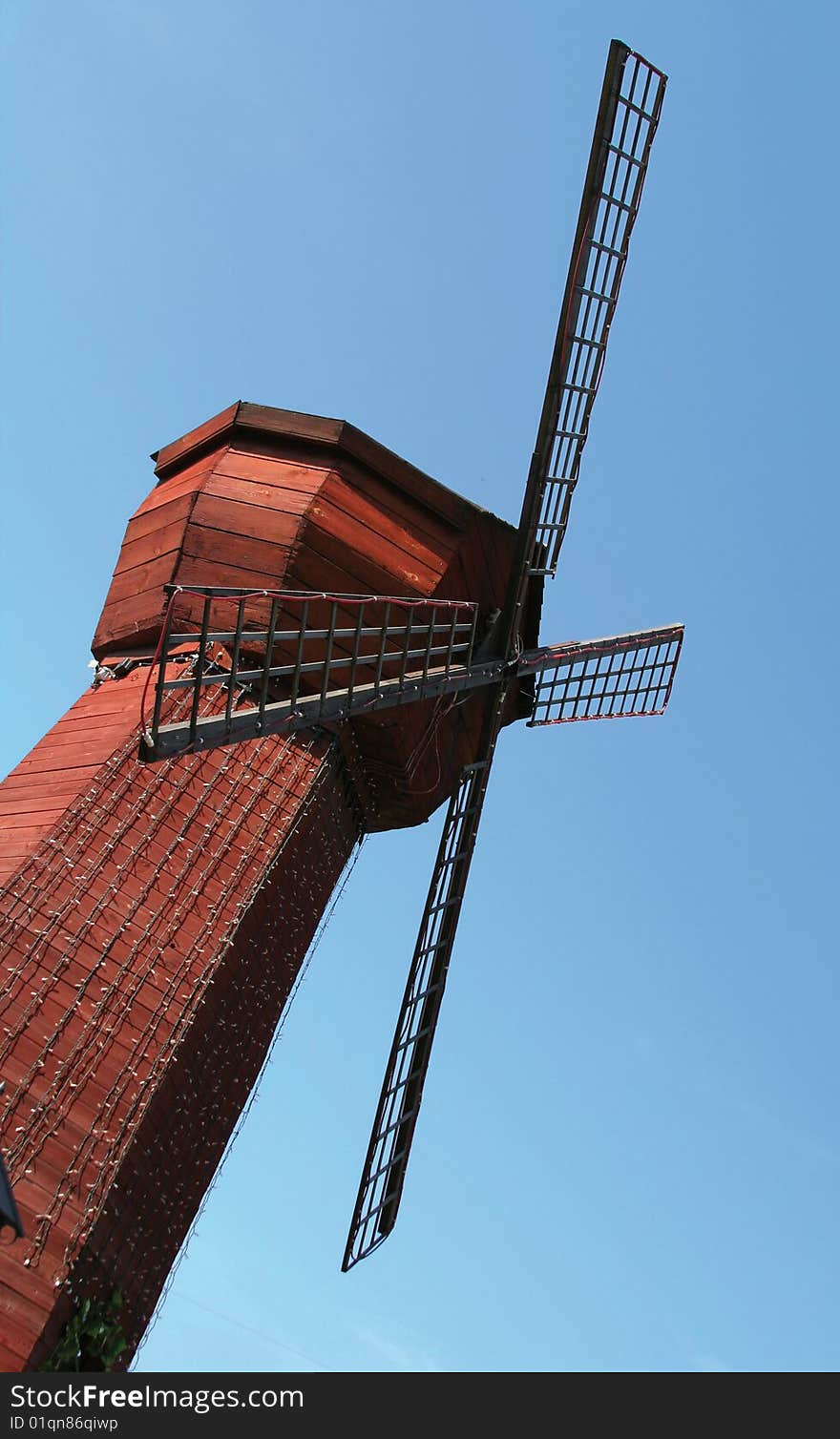 Ornamental windmill on a blue sky. Ornamental windmill on a blue sky