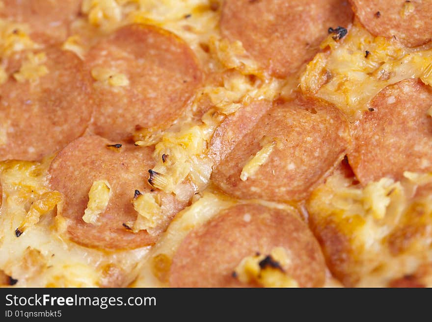 A couple of delicious pizzas, with raw tomatoes, green peppers and salami. A couple of delicious pizzas, with raw tomatoes, green peppers and salami