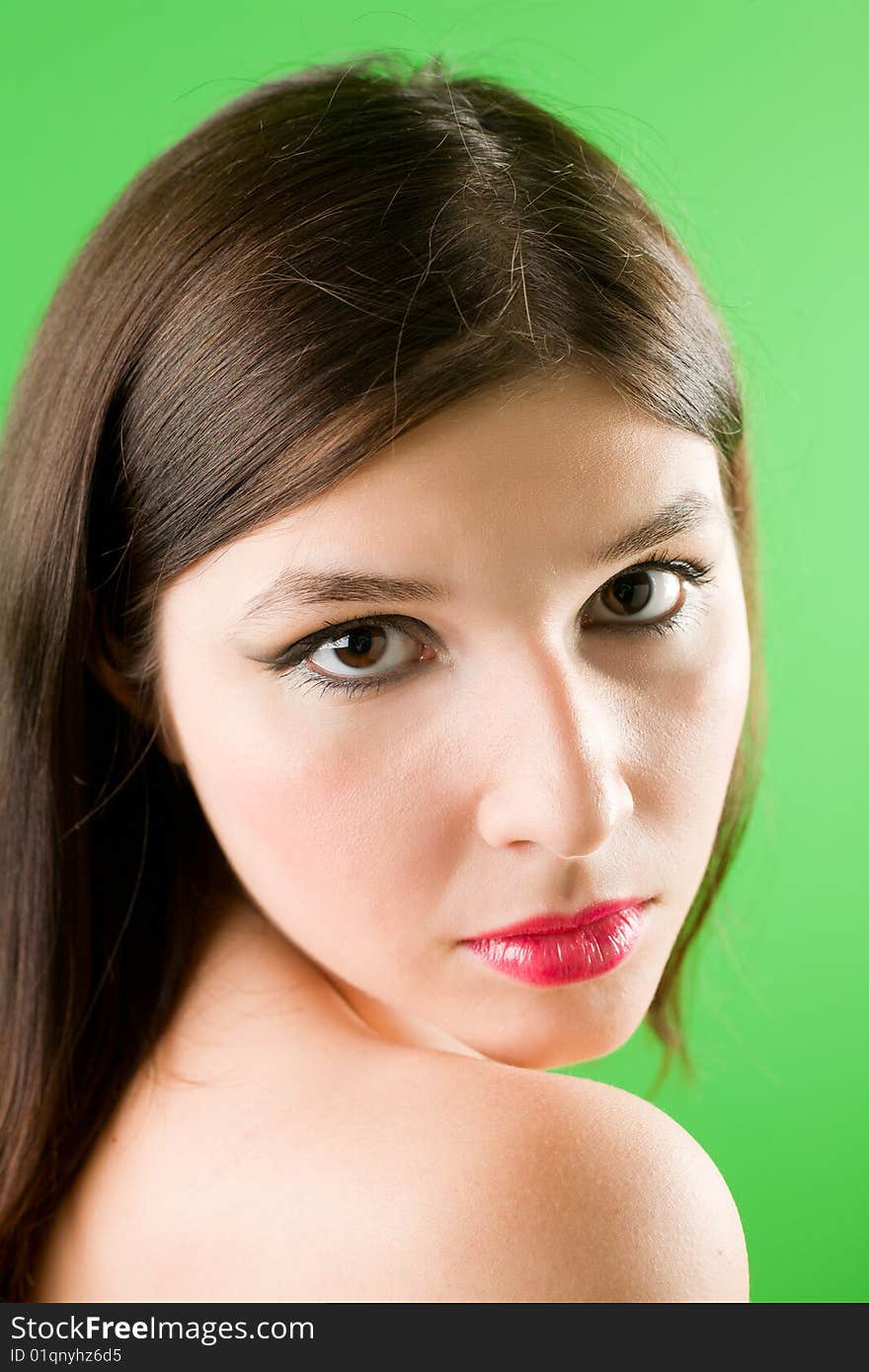 Portrait of a young beautiful girl with long dark hair