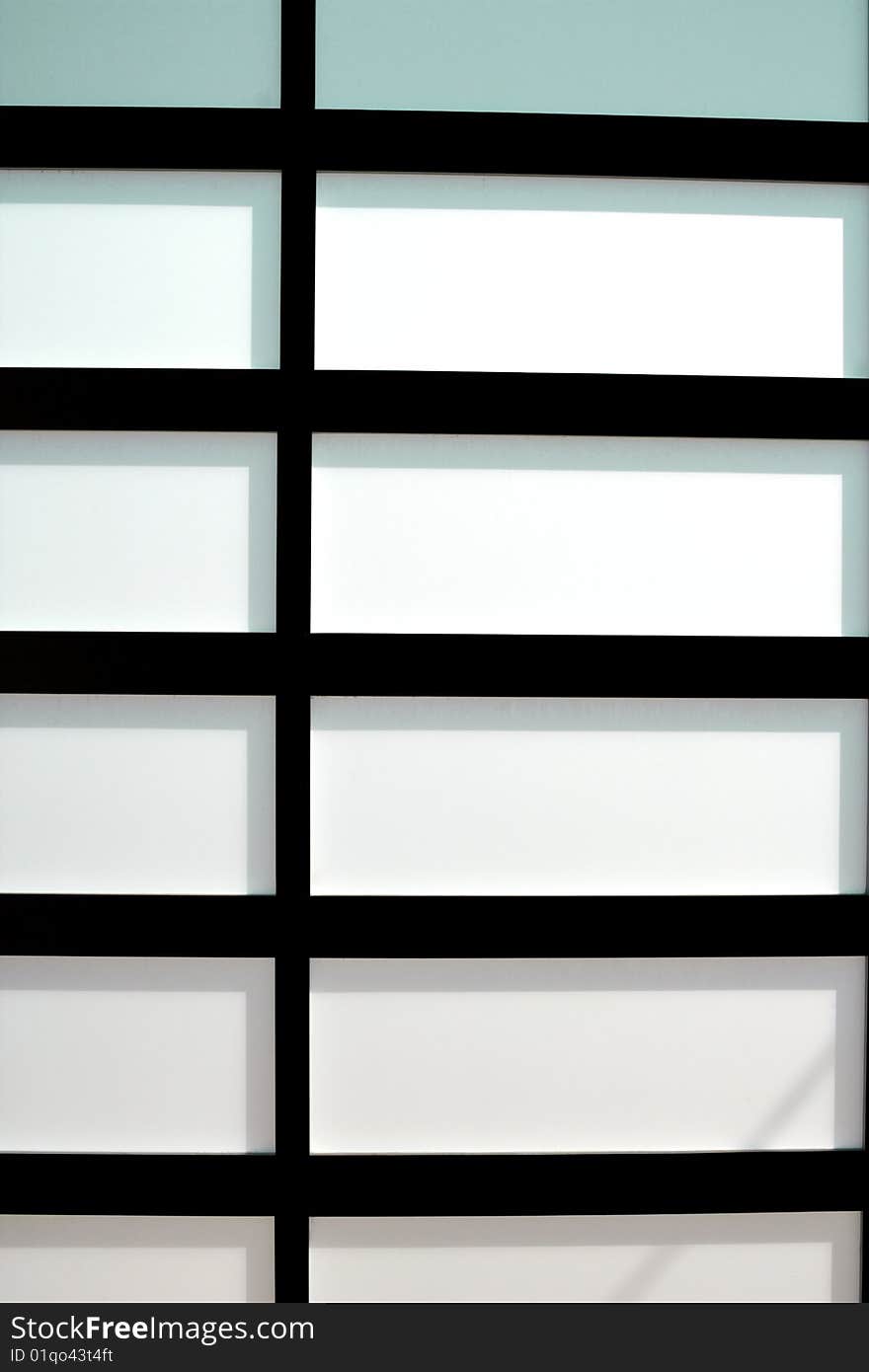 Modern glass door with a grid