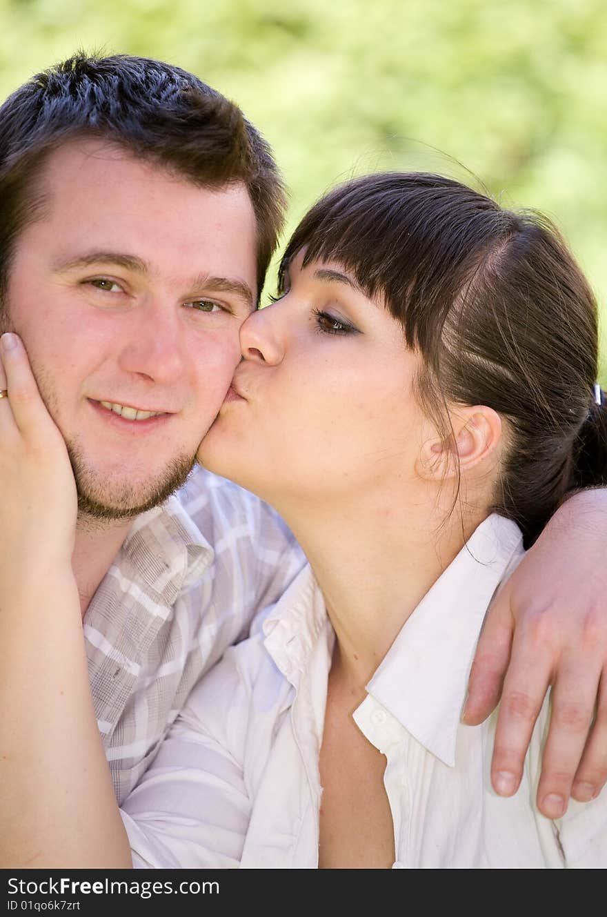 Happy couple together sitting on grass. Happy couple together sitting on grass