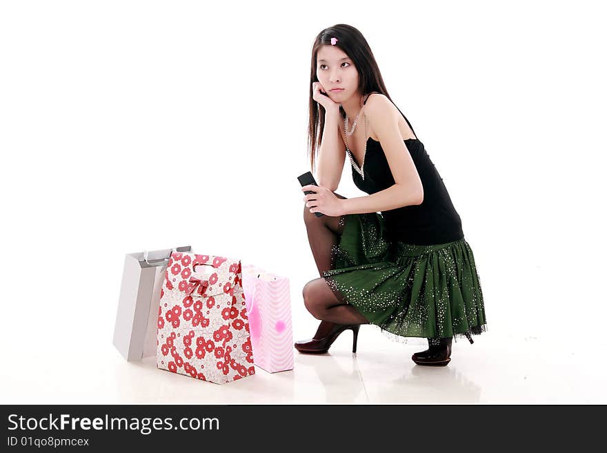 Asian shopping girl is waiting for her friend anxiously.