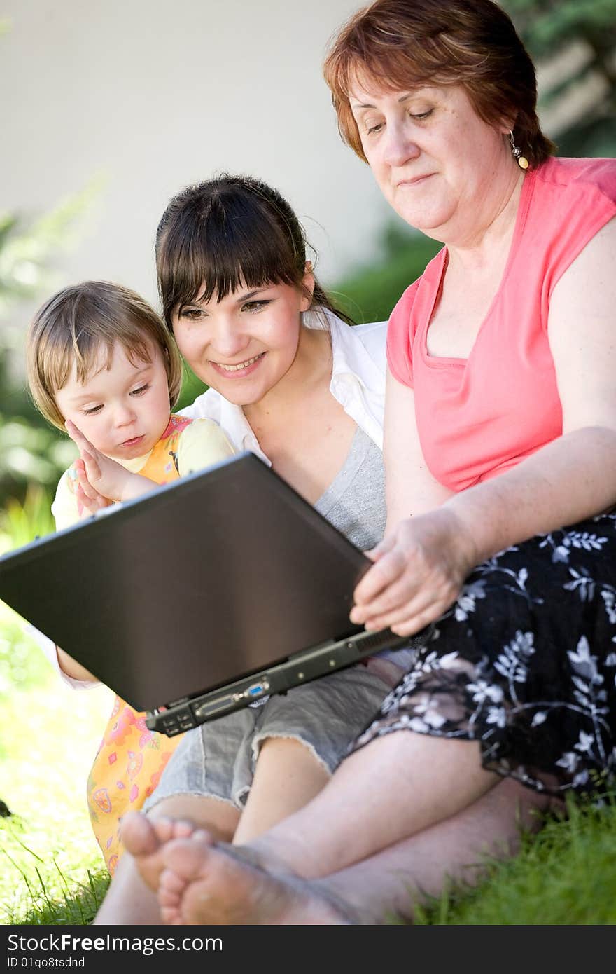 Happy family together relaxing in park. Happy family together relaxing in park