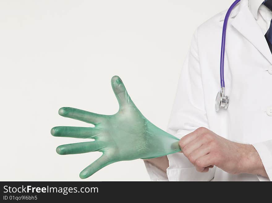 Medical professional pulling on glove. Medical professional pulling on glove