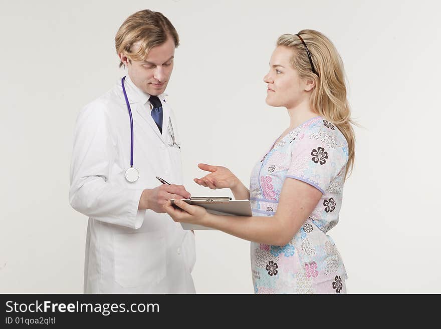 Portrait of two medical professionals conversing. Portrait of two medical professionals conversing