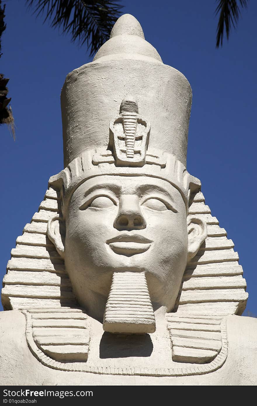 Replica statue of ramses II against a blue sky
