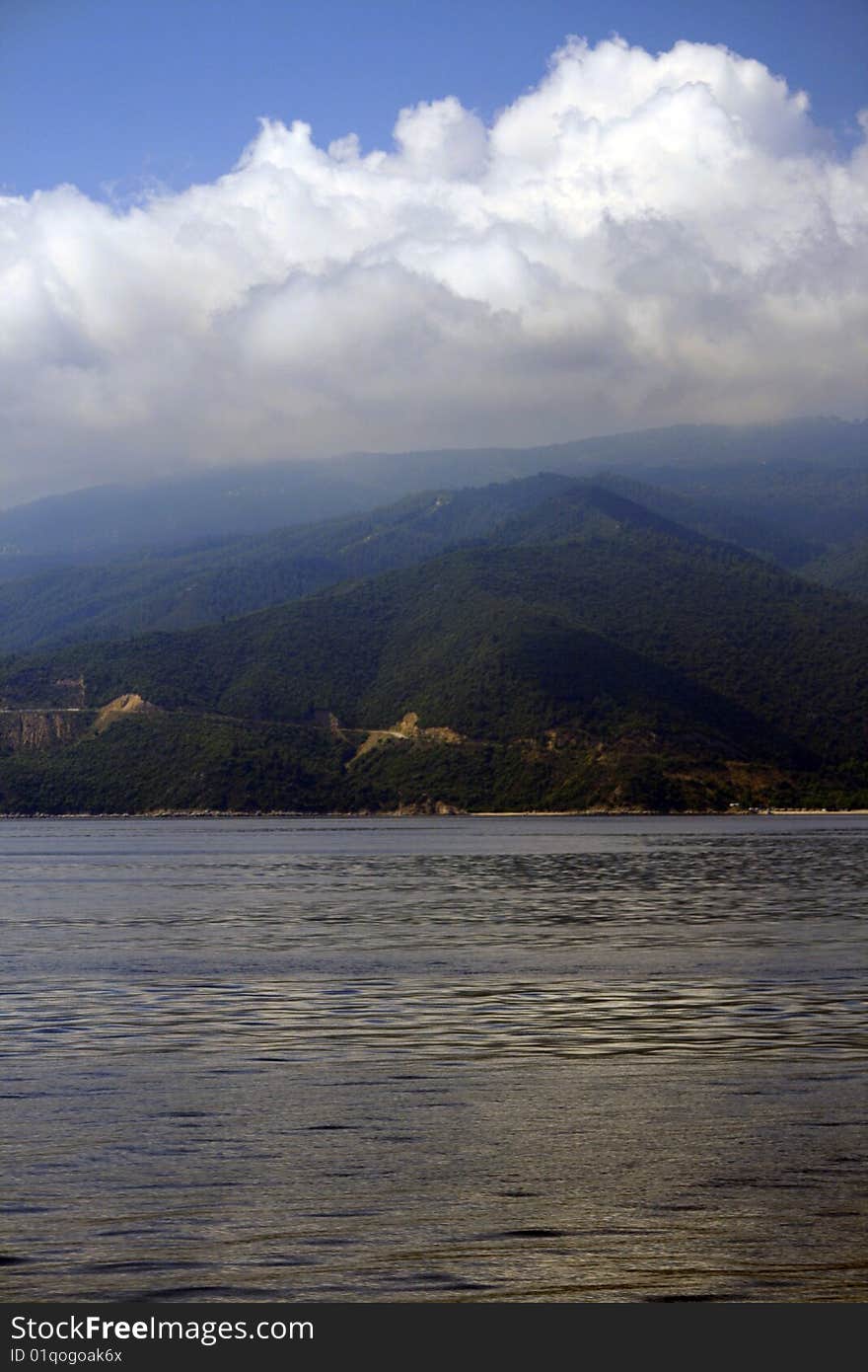 The athos mountain over clouds