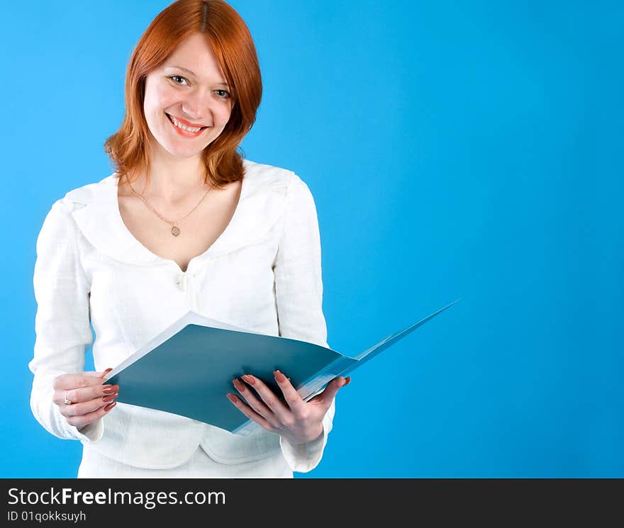 Pretty secretary held folder, isolated on blue background