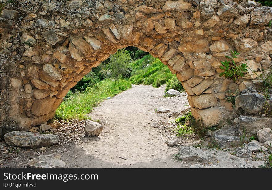 Ancient stone arch on the hiking trail outdoor. Ancient stone arch on the hiking trail outdoor