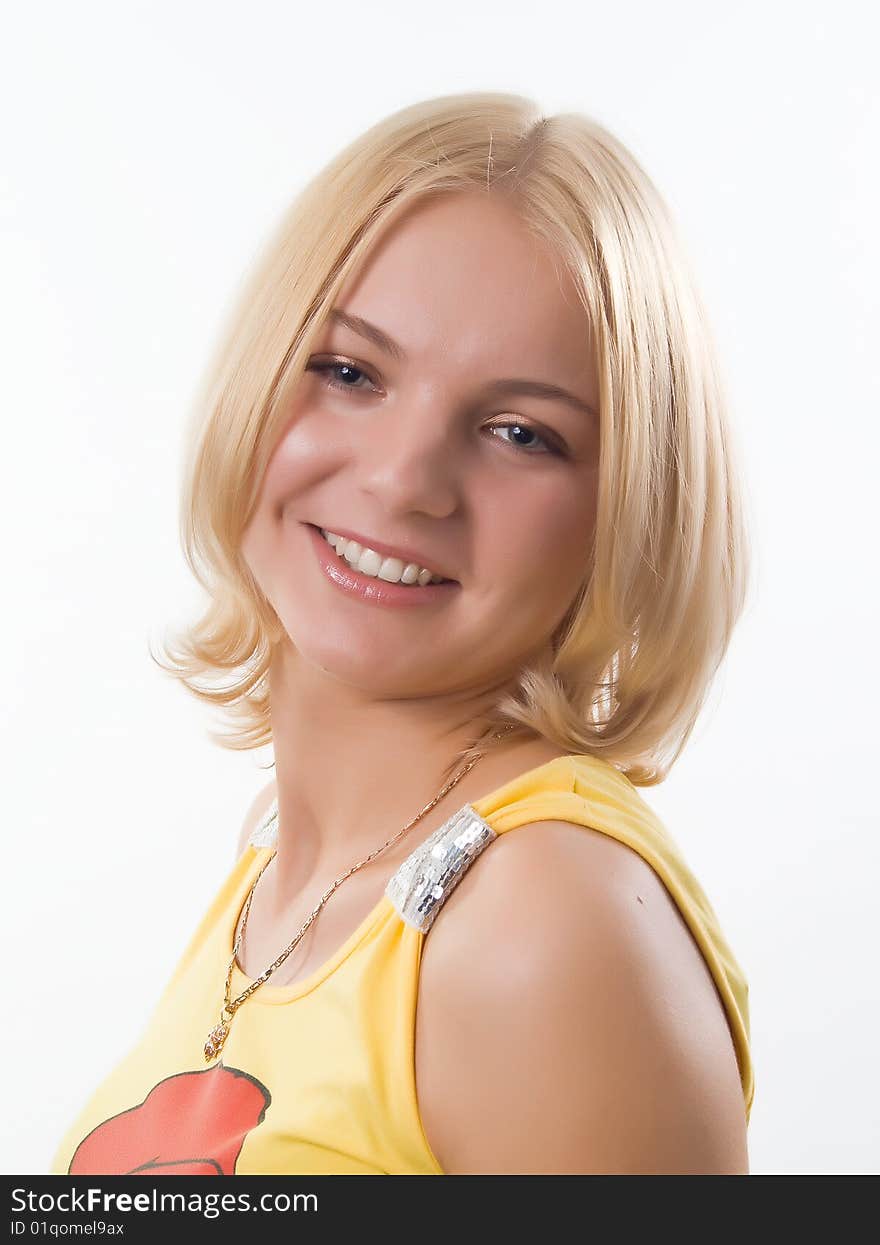 Portrait of blond smiling girl in yellow , on white background. Portrait of blond smiling girl in yellow , on white background