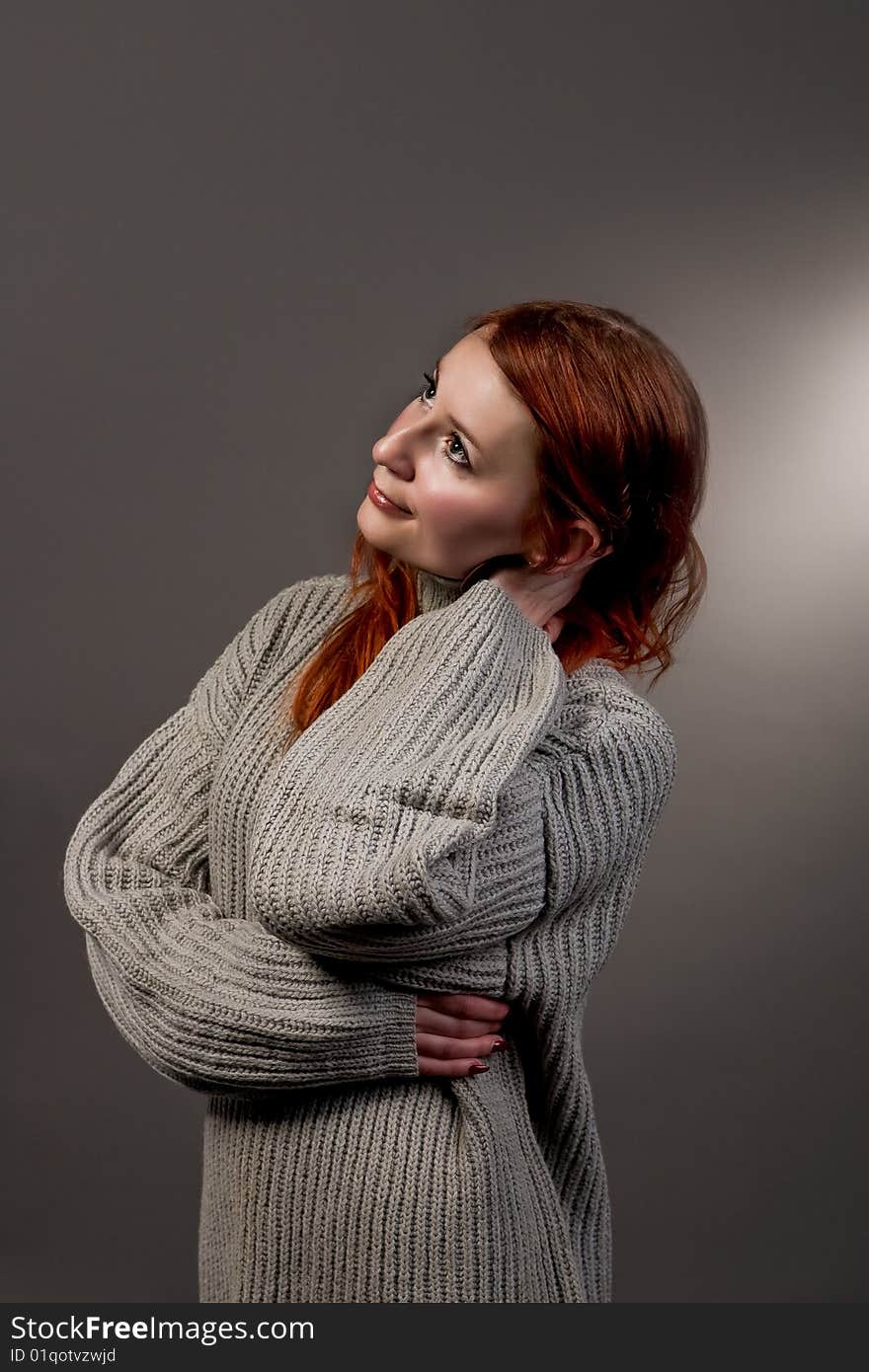 Looking up red haired girl smiling isolated