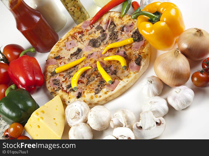 A couple of delicious pizzas, with raw tomatoes, green peppers and mushrooms. A couple of delicious pizzas, with raw tomatoes, green peppers and mushrooms