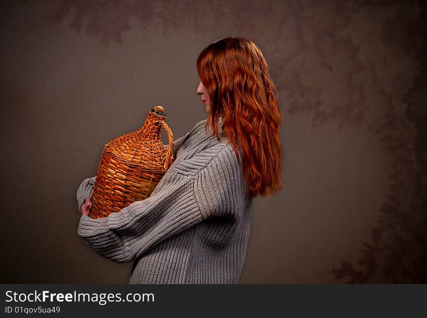 Pretty young woman standing backwards with jar isolated. Pretty young woman standing backwards with jar isolated