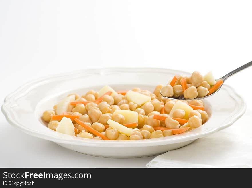 Chickpeas delicious homemade carrot and potato dish isolated. Chickpeas delicious homemade carrot and potato dish isolated