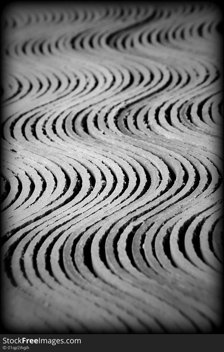 Cement tile in rows forming textured waves. Cement tile in rows forming textured waves.