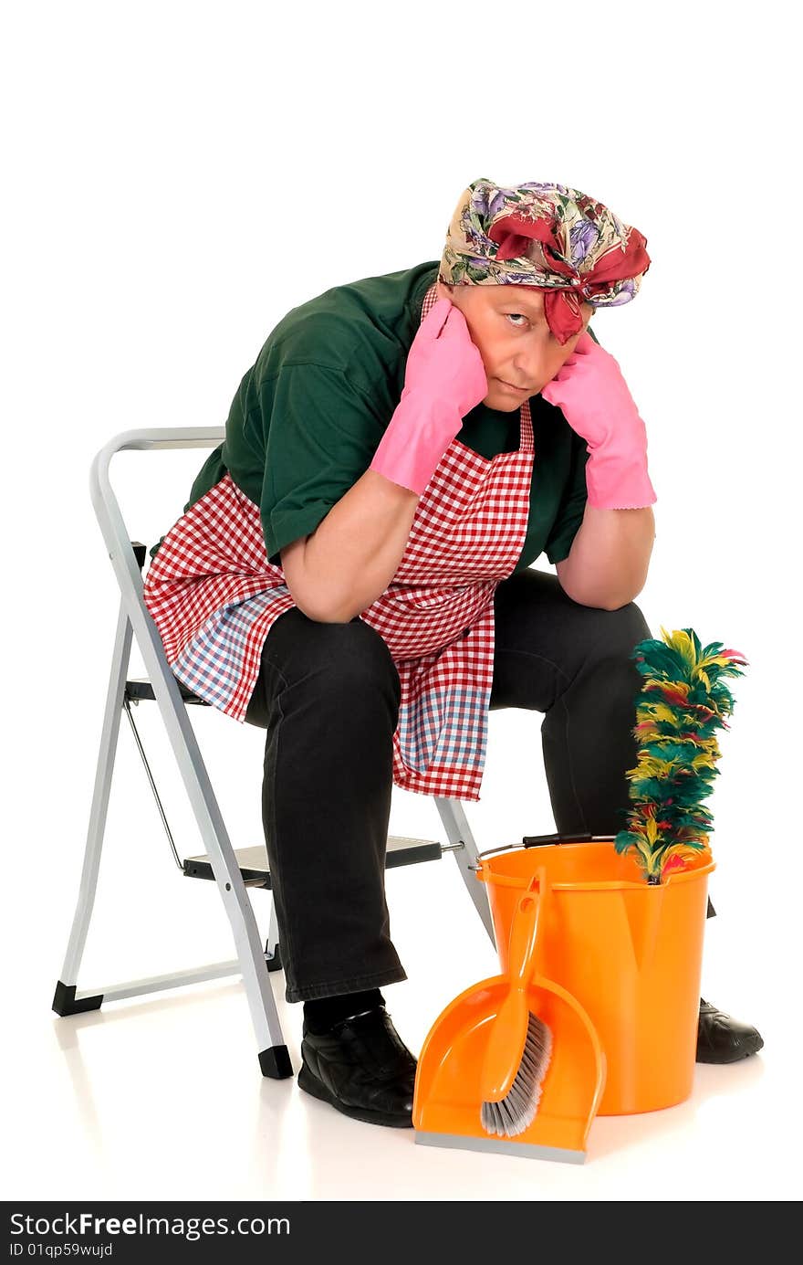 Middle aged housewife with cleansing tools doing household. Middle aged housewife with cleansing tools doing household