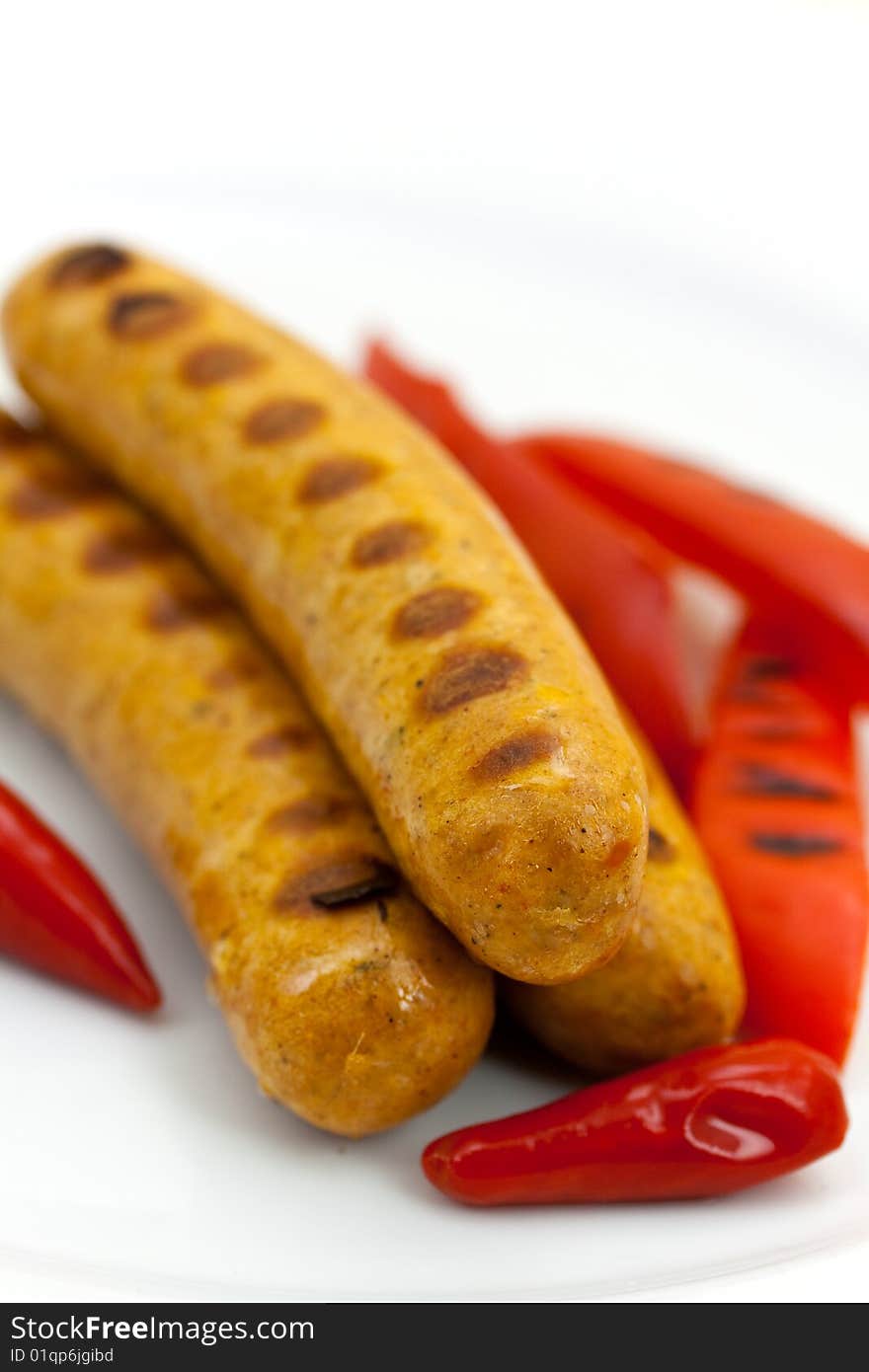 Fresh grilled sausages with red bell pepper