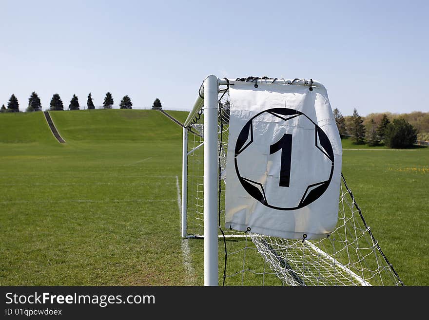 Soccer goal and ball sign on field. Soccer goal and ball sign on field