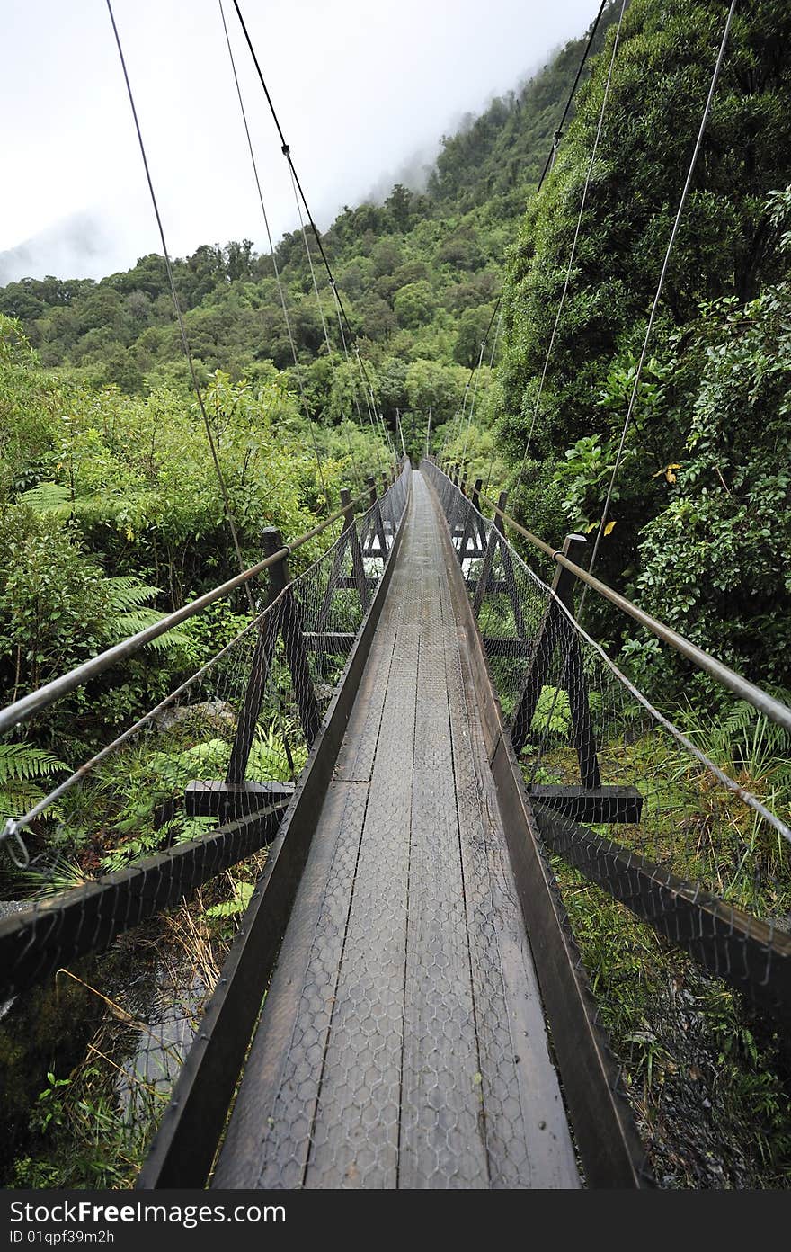 Wooden hanging bridge in the mountainous area