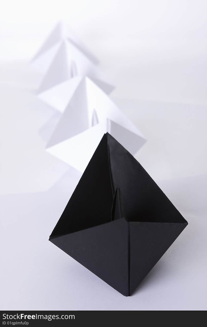 Black Paper Boat In The Line