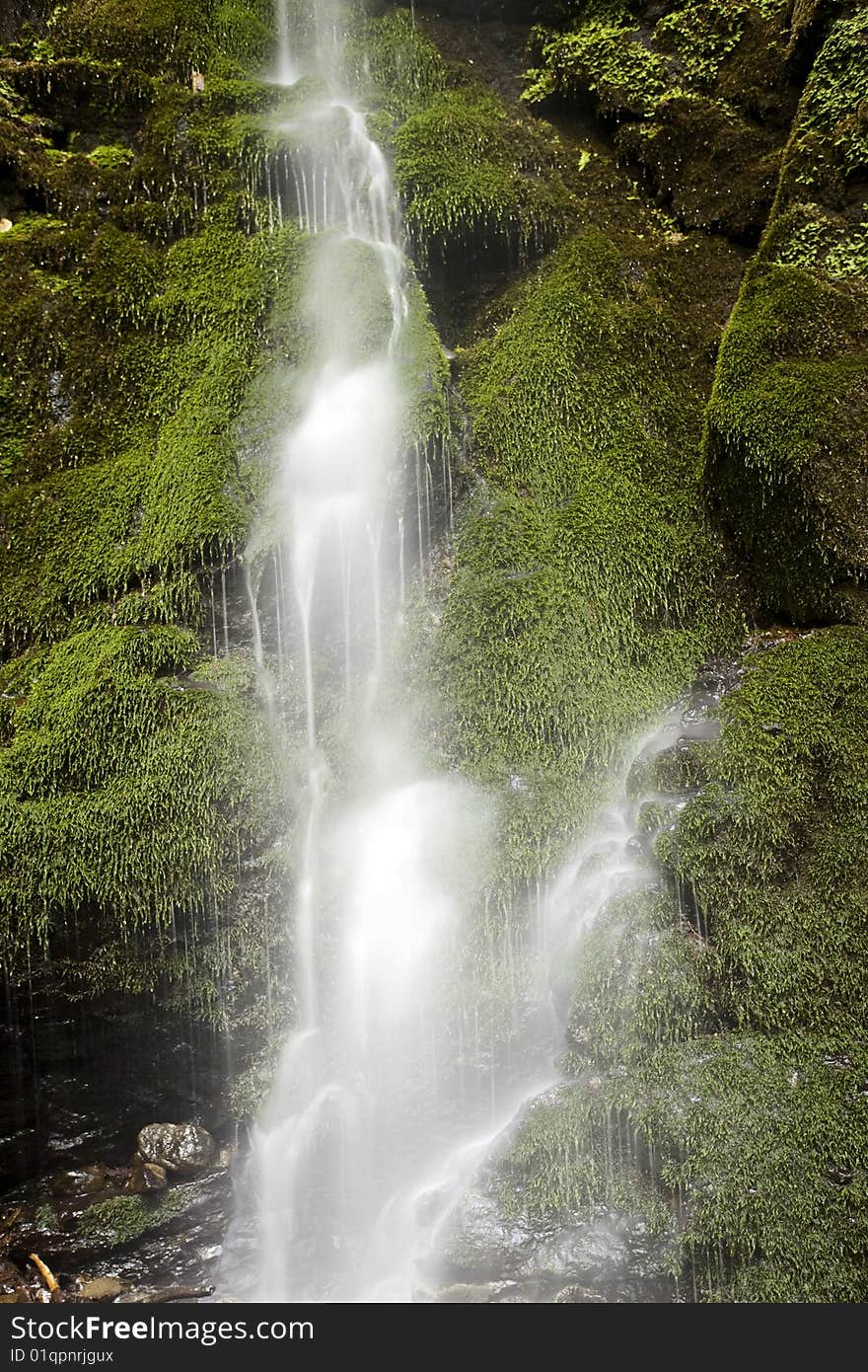 Waterfall with mossy rocks