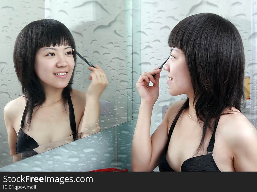 Asian girls in the bathroom with make-up. Asian girls in the bathroom with make-up.