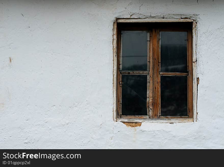 Old wooden window and wall of mud. Old wooden window and wall of mud