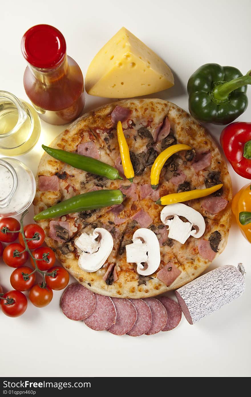 A couple of delicious pizzas, with raw tomatoes, green peppers and mushrooms. A couple of delicious pizzas, with raw tomatoes, green peppers and mushrooms