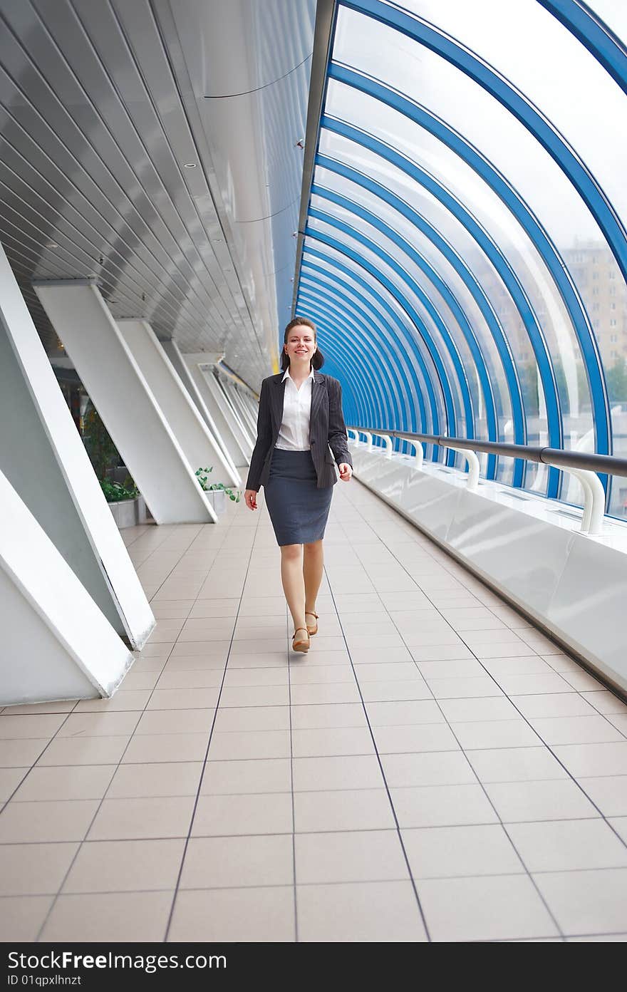 Very cute modern professional businesswoman walking