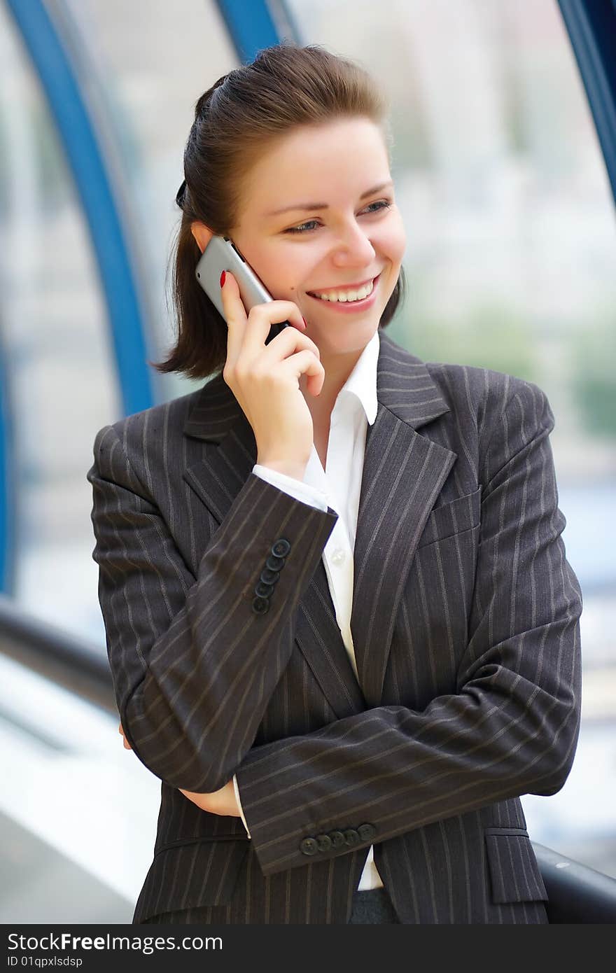 Modern professional businesswoman with phone