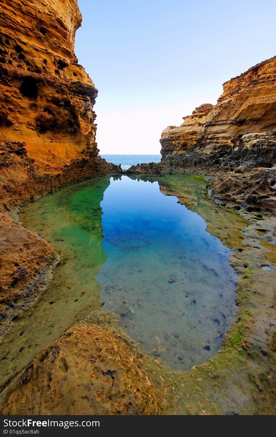 Water reflection and cliff walls