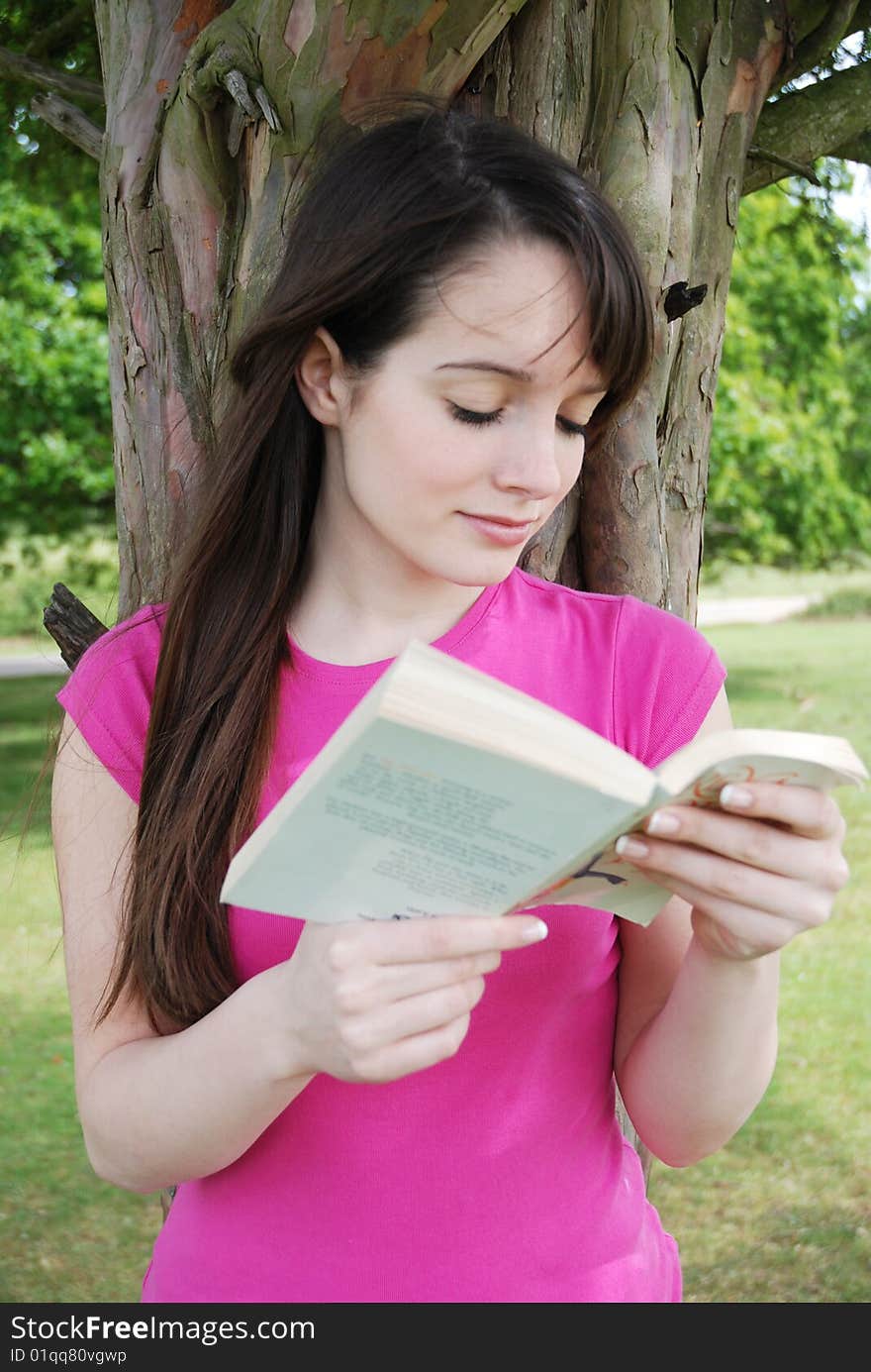 Young teenager reading a book. Young teenager reading a book