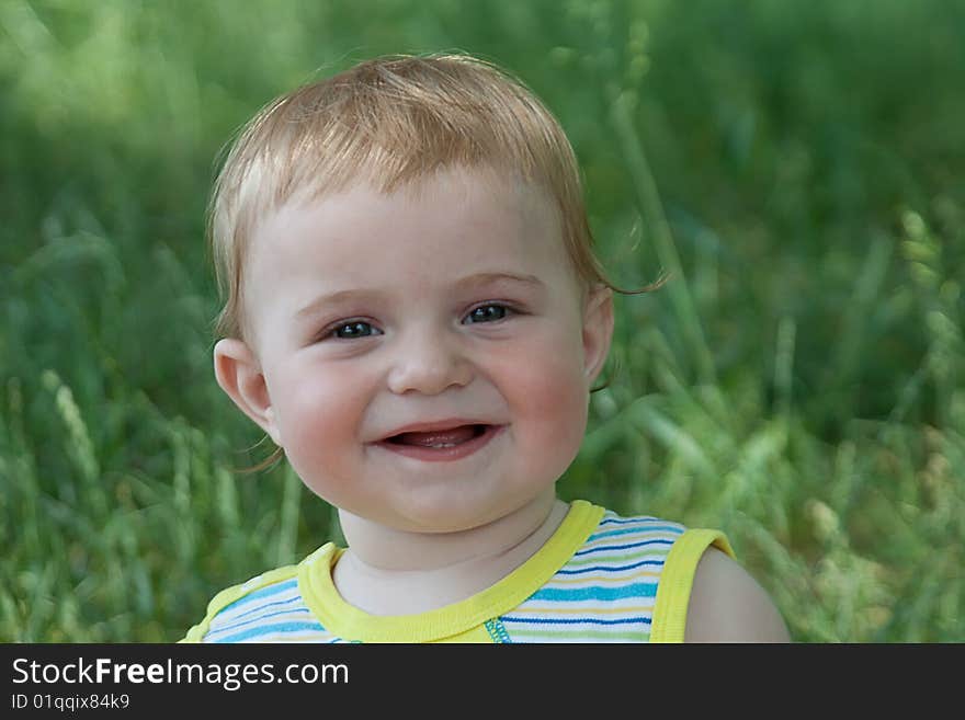 The baby on a grass. The baby on a grass